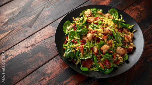 Roasted brussel sprouts, bacon warm salad with spinach, croutons and hazelnuts