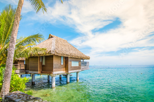 Overwater villa at the beach of Tahiti.