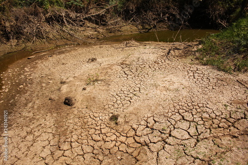 Scene of a stream that is drying up because of a severe drought.