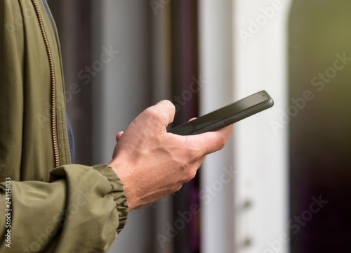 person using smartphone in one hand