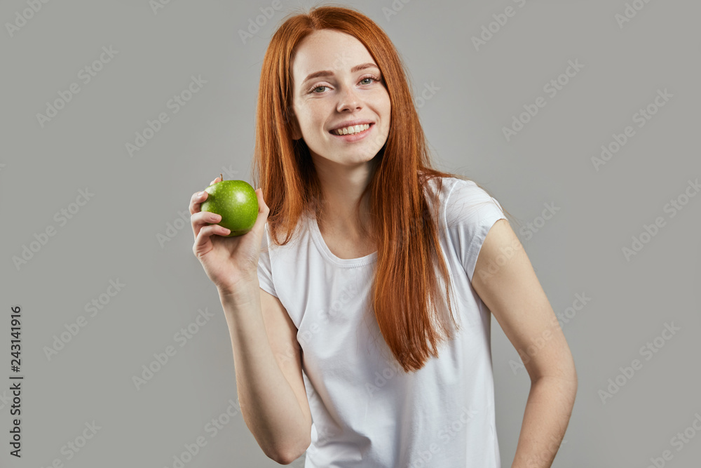 beautiful ginger girl with apple, diet, wellneing, wellness concept . right food beautiful ginger girl with apple, diet, wellneing, wellness concept . right food