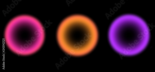Blurred glowing isolated circles on black background. Yellow, pink. violet colors