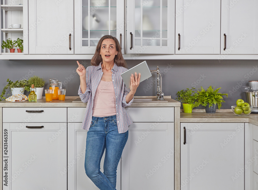 Young woman in the kitchen Young woman in the kitchen