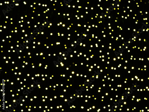 Abstract background with stars, glitter golden lights on black background