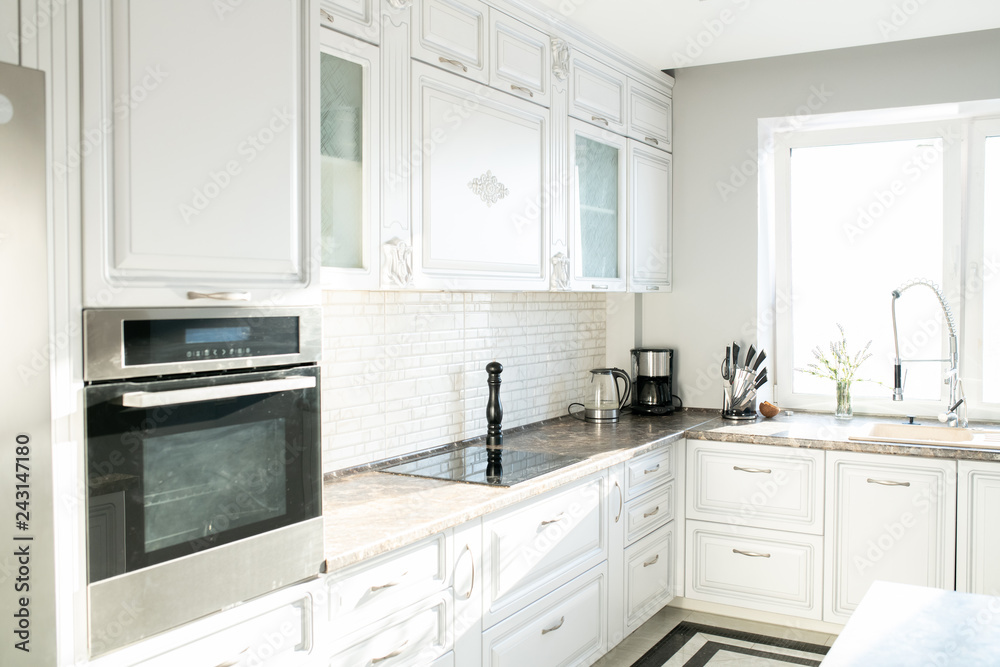 Background image of empty white kitchen with modern design and appliances lit by sunlight, copy space Background image of empty white kitchen with modern design and appliances lit by sunlight, copy space