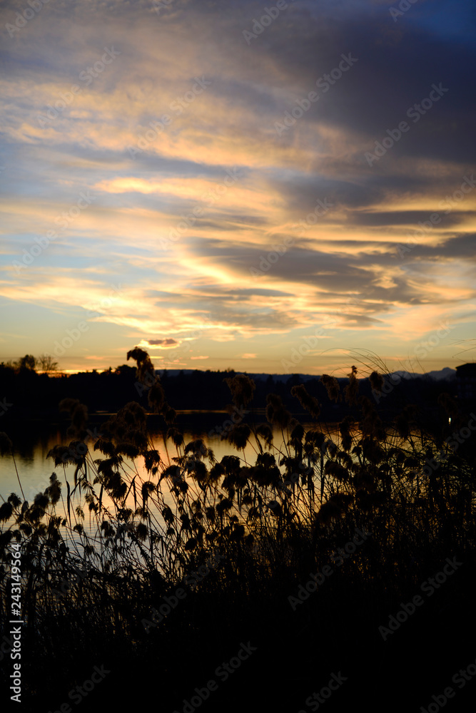 Obraz premium Sesto Calende. sunset on the river