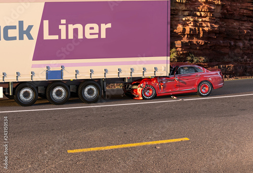 Red car crashed on big truck On the road with environment. photo