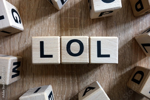 Canvas Print Lol text from wooden blocks on desk