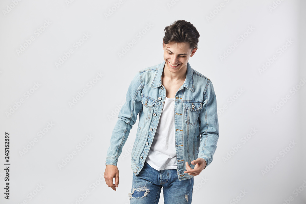 Young Male with a Beard Wearing a White Tshirt with a Denim Jacket and  Posing Against a Wall Stock Photo  Image of posing stylish 201822040