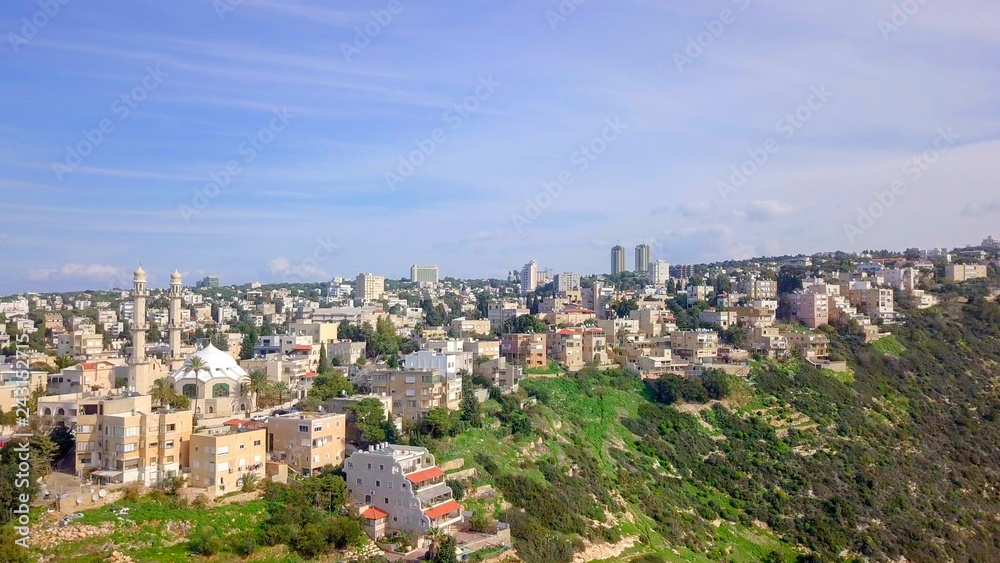 Aerial image of the city of Haifa, Israel above and over the slopes of Mount Carmel.