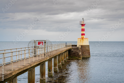 The Pier Lighthouse in Amble in Northumberland, England, UK, seen from the South Pier