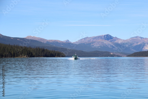 Boat On Maligne Lake, Jasper National Park, Alberta © Michael Mamoon