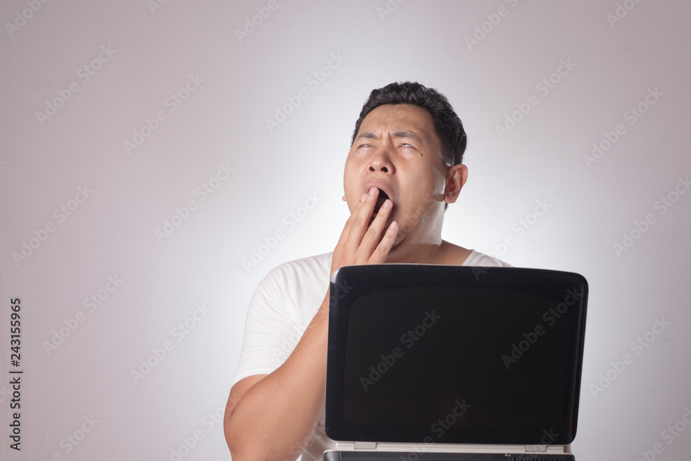 Tired Sleepy Man Overworked with Laptop Tired Sleepy Man Overworked with Laptop
