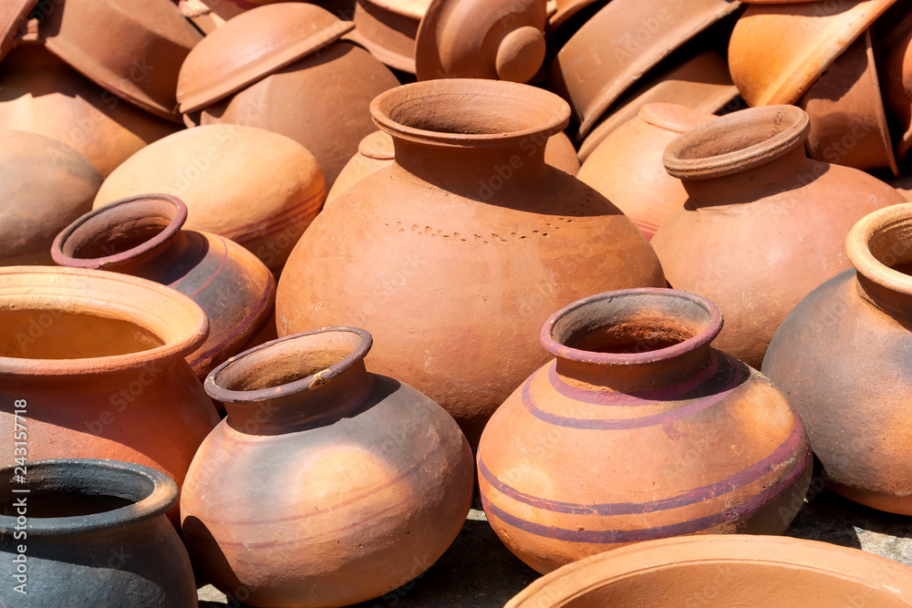 Pots, dishes, and other articles made of baked clay.