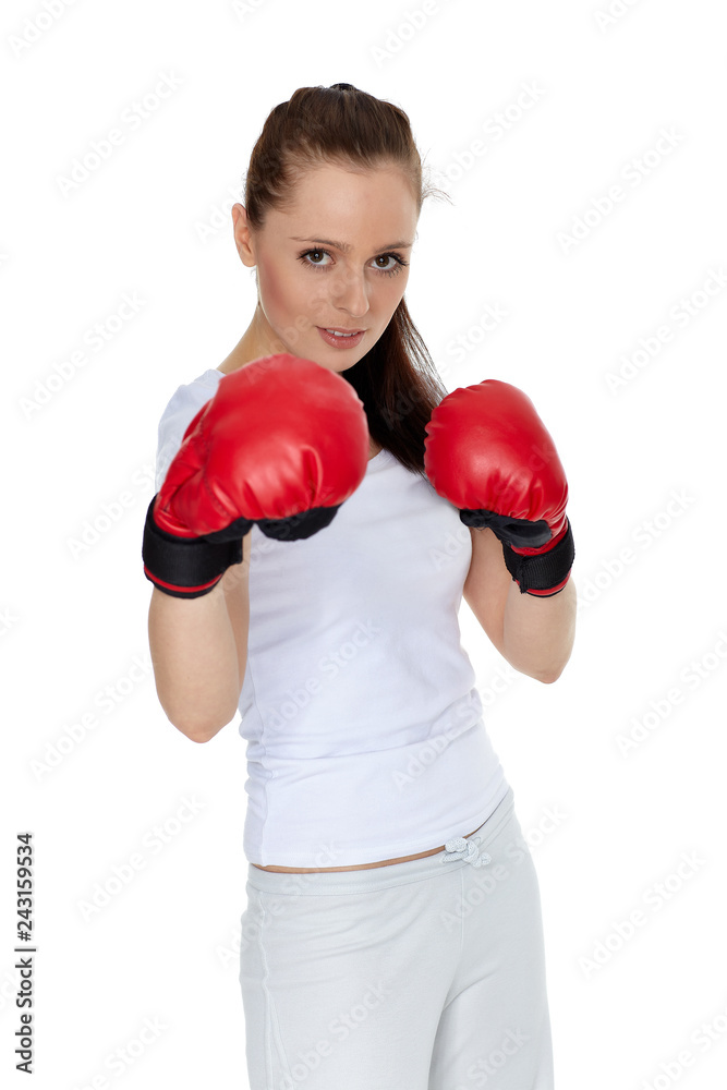 Young woman in fighting gloves Young woman in fighting gloves