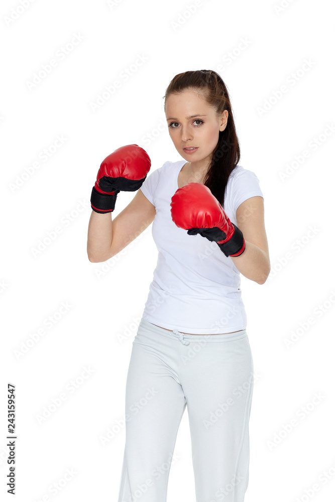 Young woman in fighting gloves
