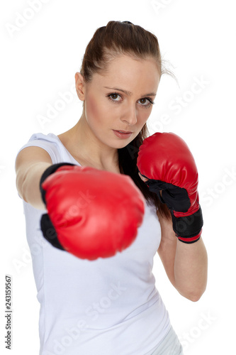 Young woman in fighting gloves