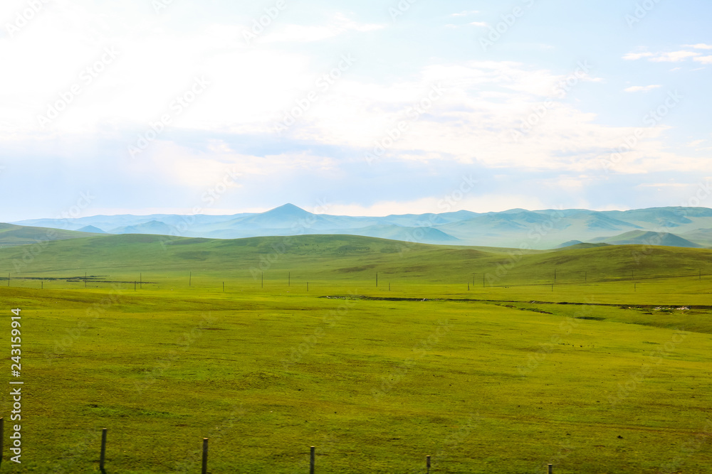 Mongolian country-side as seen out of a passenger car of the Transsiberian Railway near Ulaanbaatar (Ulaanbaatar, Mongolia, Asia)