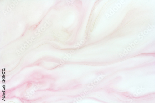 delicate marble background in pink colors, mix of paints