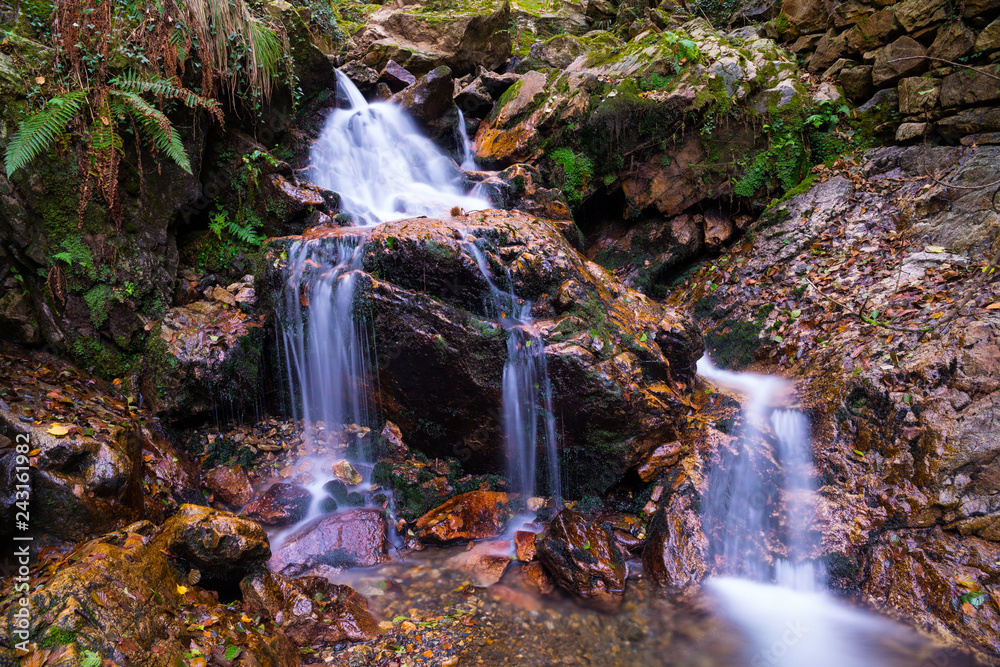 Little waterfall (named Irusta) surronded by the forest of Aiako Harriak mountain at Basque Country.