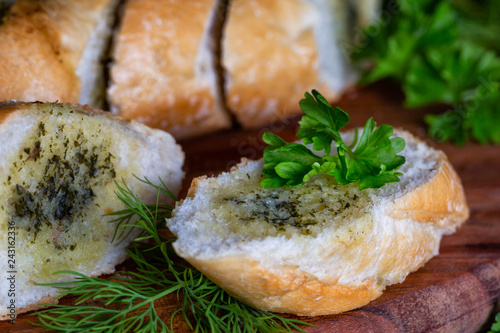 Fresh herb baguette with dill and parsley photo