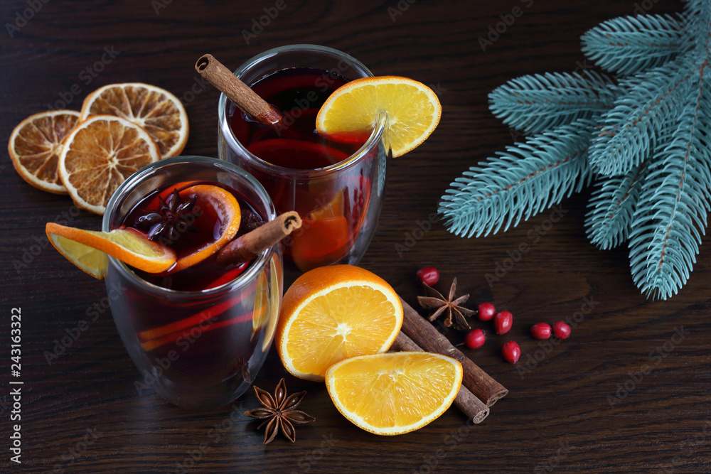 Glasses with mulled wine on brown background Glasses with mulled wine on brown background
