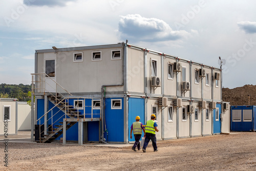 Workers at mobile containers and cabins base