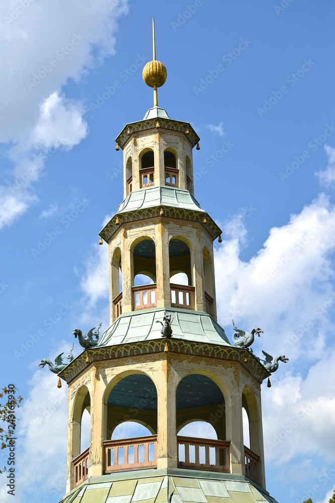POTSDAM, GERMANY. A three-storied tower of a lodge with dragons the park of San Sushi POTSDAM, GERMANY. A three-storied tower of a lodge with dragons the park of San Sushi