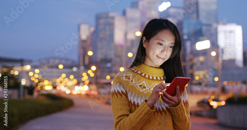 Photography Woman use of mobile phone at the street