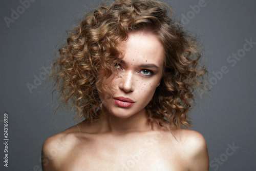 Beautiful freckles woman. amazing curly girl