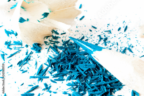 Detalle y textura de virutas de lapiz de dibujo  color azul sobre fondo blanco photo