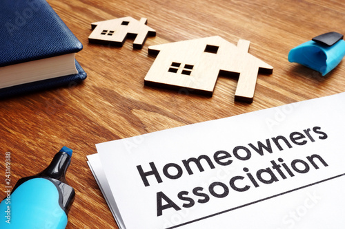 Documents about Homeowners Association HOA on a desk. photo