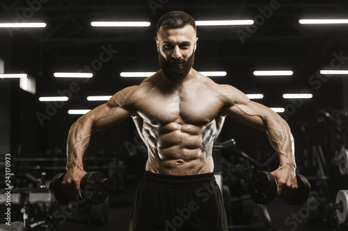 Handsome strong athletic men pumping up muscles workout bodybuilding concept background