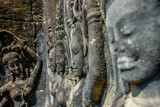 Row of dancers in profile lining the walls of Angkor Wat
