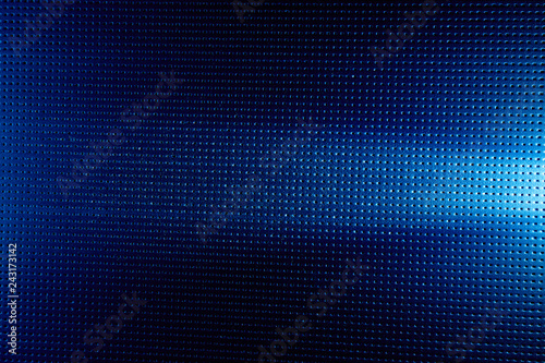Horizontal beam of white light on a blue background to a black dot