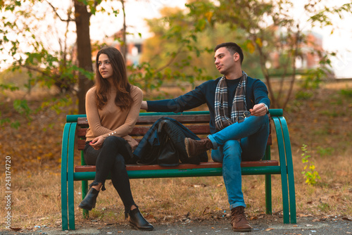 Angry girlfriend  ignoring her boyfriend while he is trying to apologize.