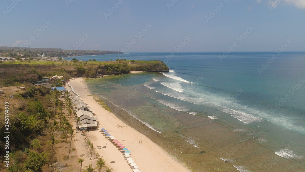 aerial view coastline with sandy tropical beach Balangan. seascape ocean surf and tropical beach large waves turquoise water crushing on shore, Bali,Indonesia. Travel concept. aerial view coastline with sandy tropical beach Balangan. seascape ocean surf and tropical beach large waves turquoise water crushing on shore, Bali,Indonesia. Travel concept.