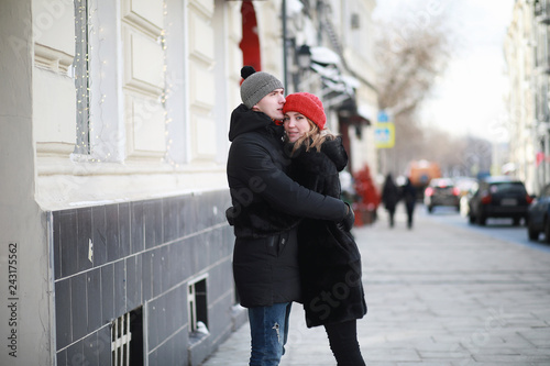 Photography Young couple walking through the winter