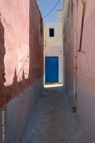 Blue door in alley  in Asilah, Morocco © monysasi