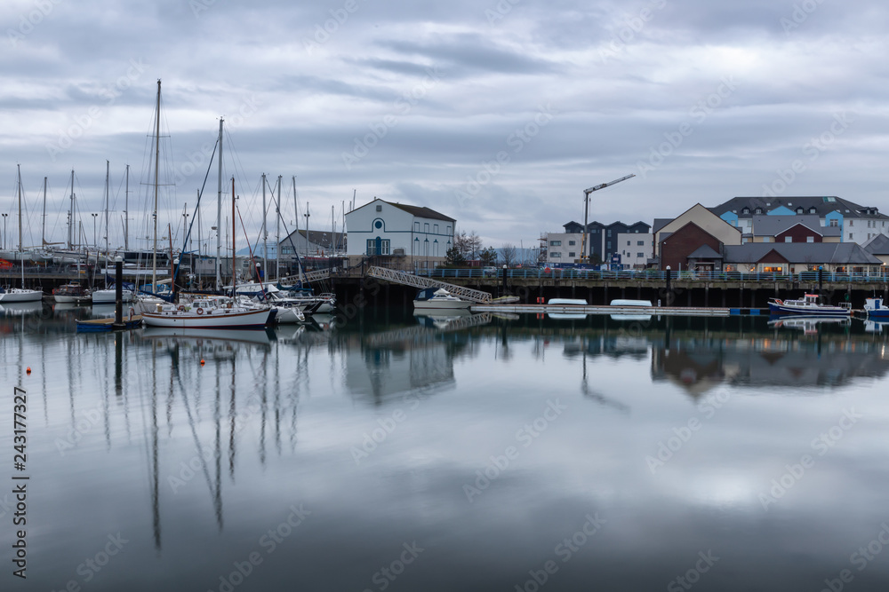 Carrickfergus Harbour with boats and reflection