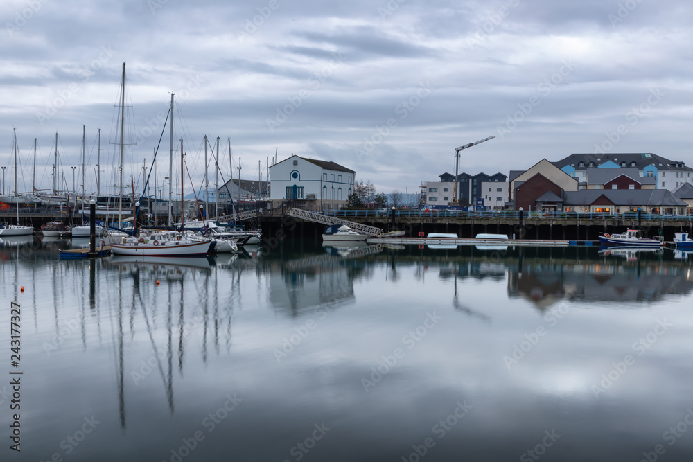 Carrickfergus Harbour with boats and reflection Carrickfergus Harbour with boats and reflection