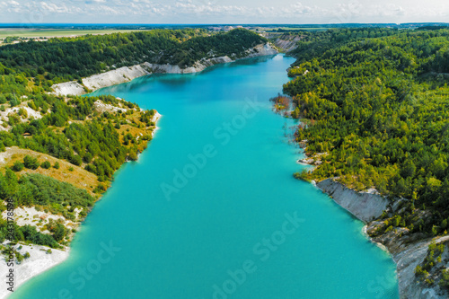 An old gypsum quarry filled with blue and pure water. Aerial view, from top to bottom © nordroden