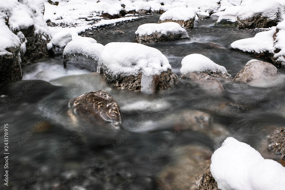 small river in winter covered with snow small river in winter covered with snow