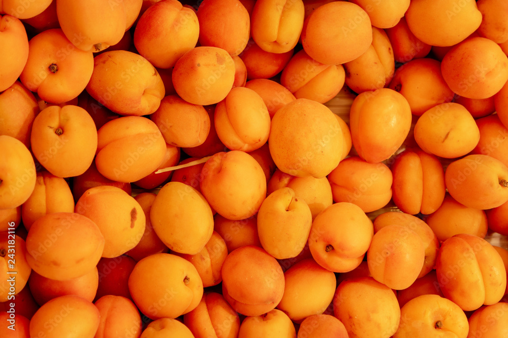 Orange Color Plums In Box Top View