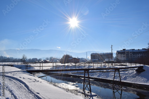 Bridge over the river in winter © Lazar