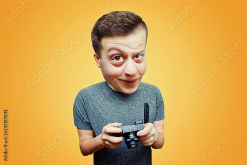 Portrait of a guy funny caricature of a surprised man with a camera in hand on a bright background