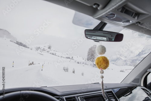 Driving along a snowcapped mountain pass