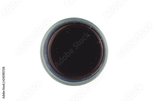 One full glass of aerated cola black color with bubbles isolated on white background. Top view. Clipping path - image
