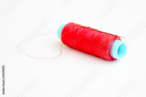 Needle and red thread photo