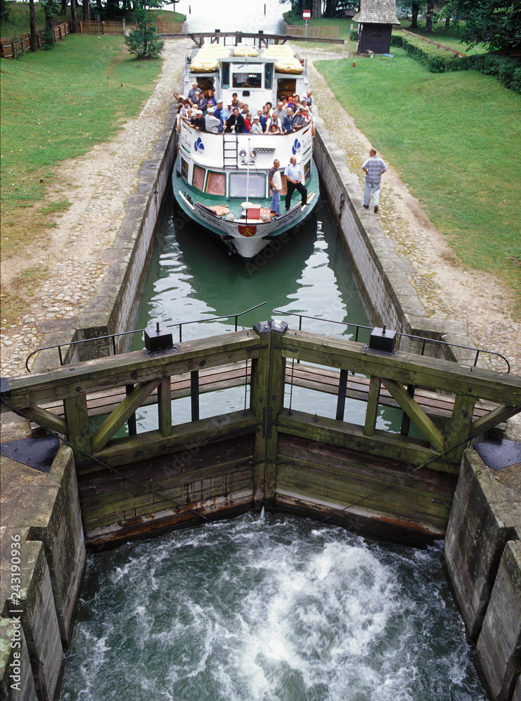 Fototapeta premium Augustow Canal, Poland - July, 2010: Gateways sluice (locks) in Przewiez